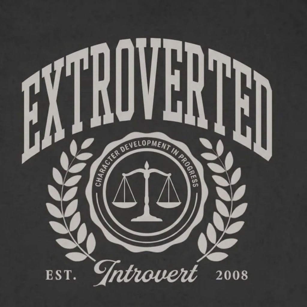 Black t-shirt with white text 'EXTROVERTED' and 'Introvert' on a dark background